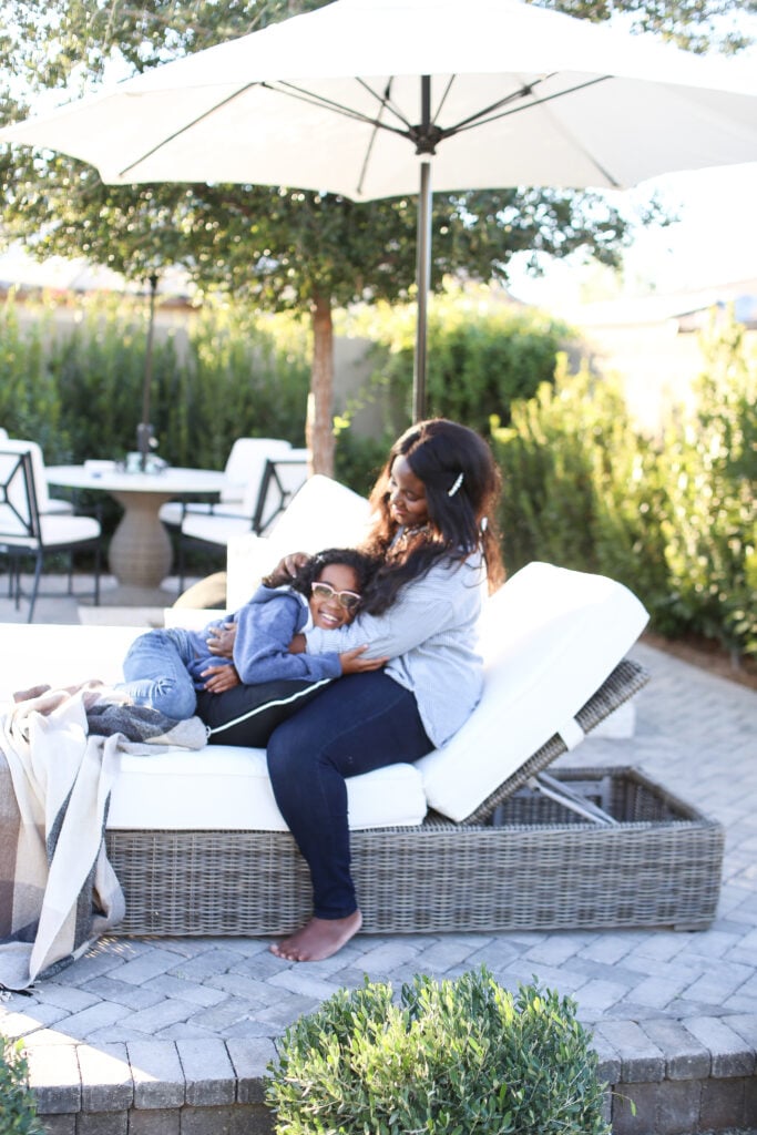 Mother and daughter on outdoor furniture in phoenix 