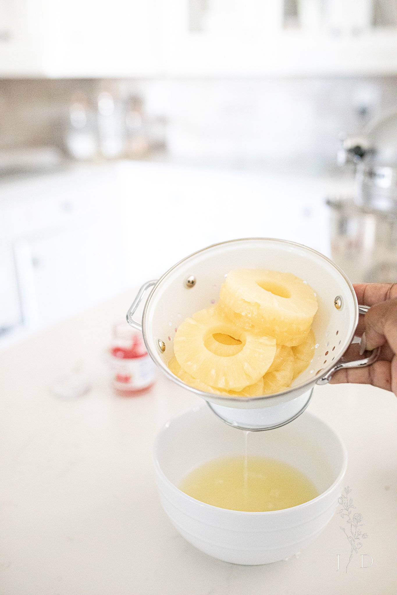 Draining pineapples in colander 