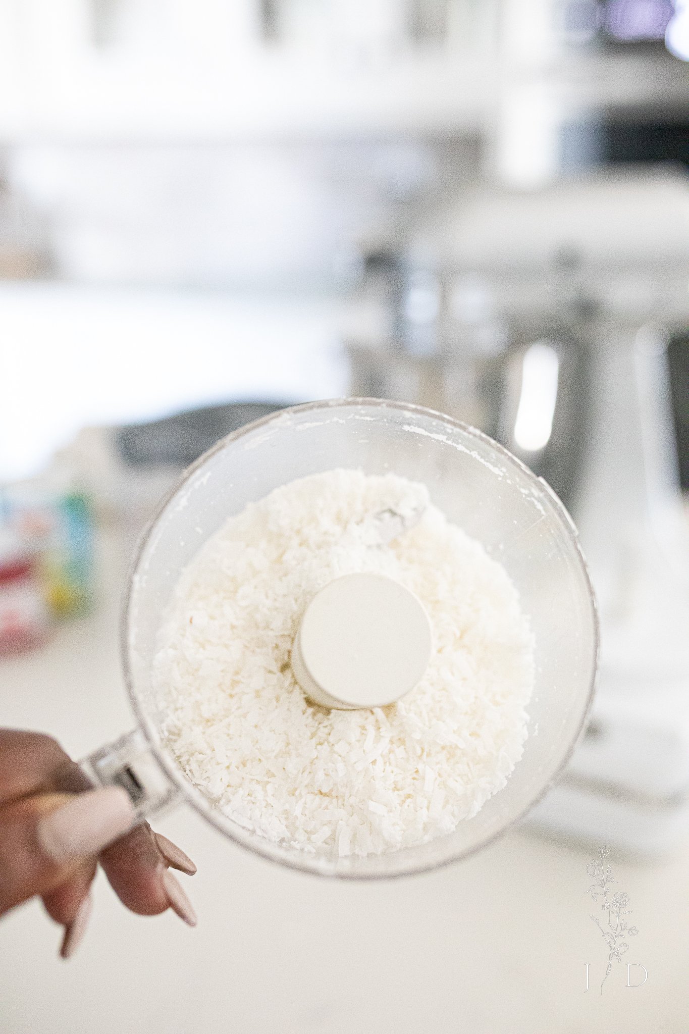 Coconut shredded in a mini food chopper. 