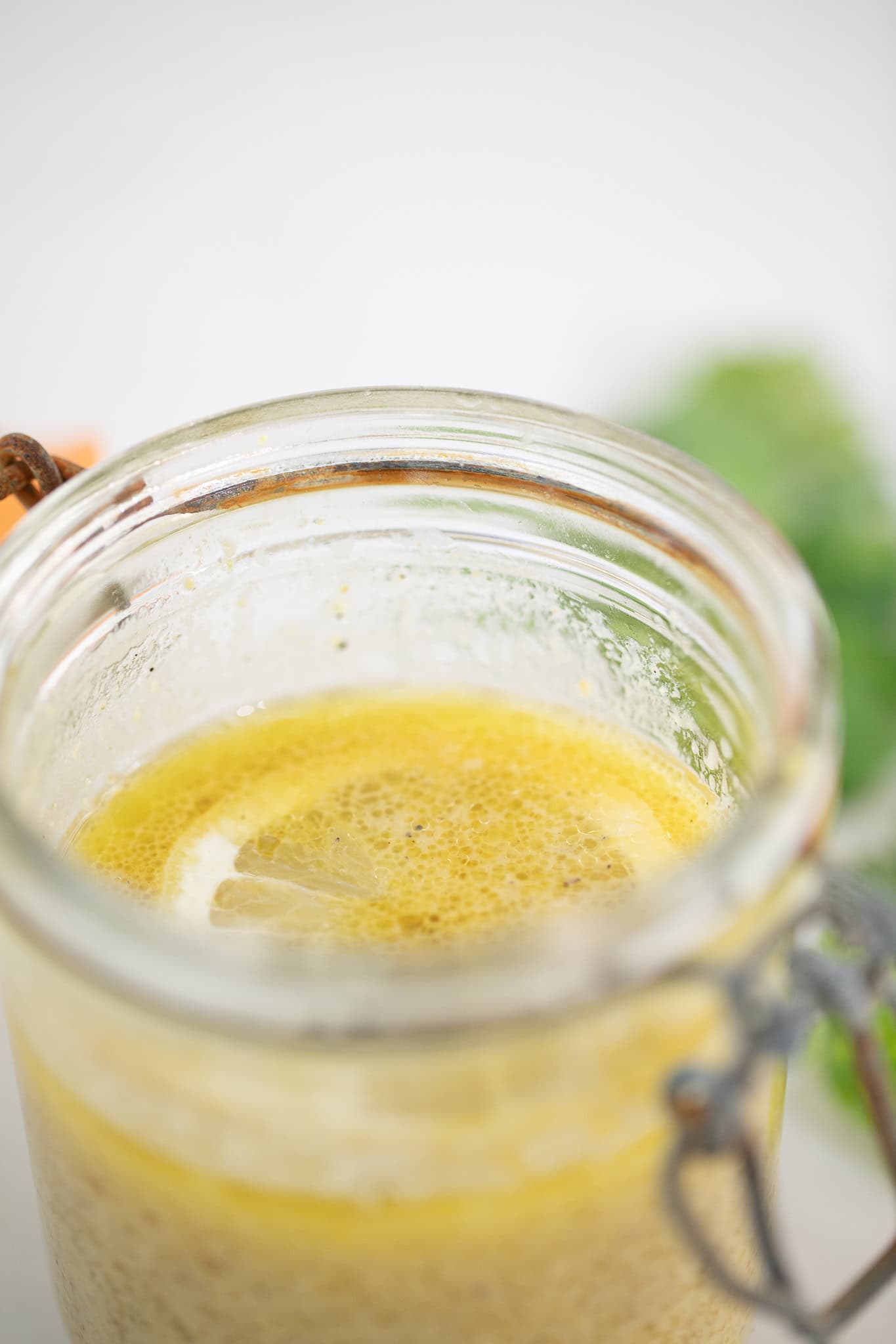 Lemon Vinaigrette stored in jar with fresh lemon 
