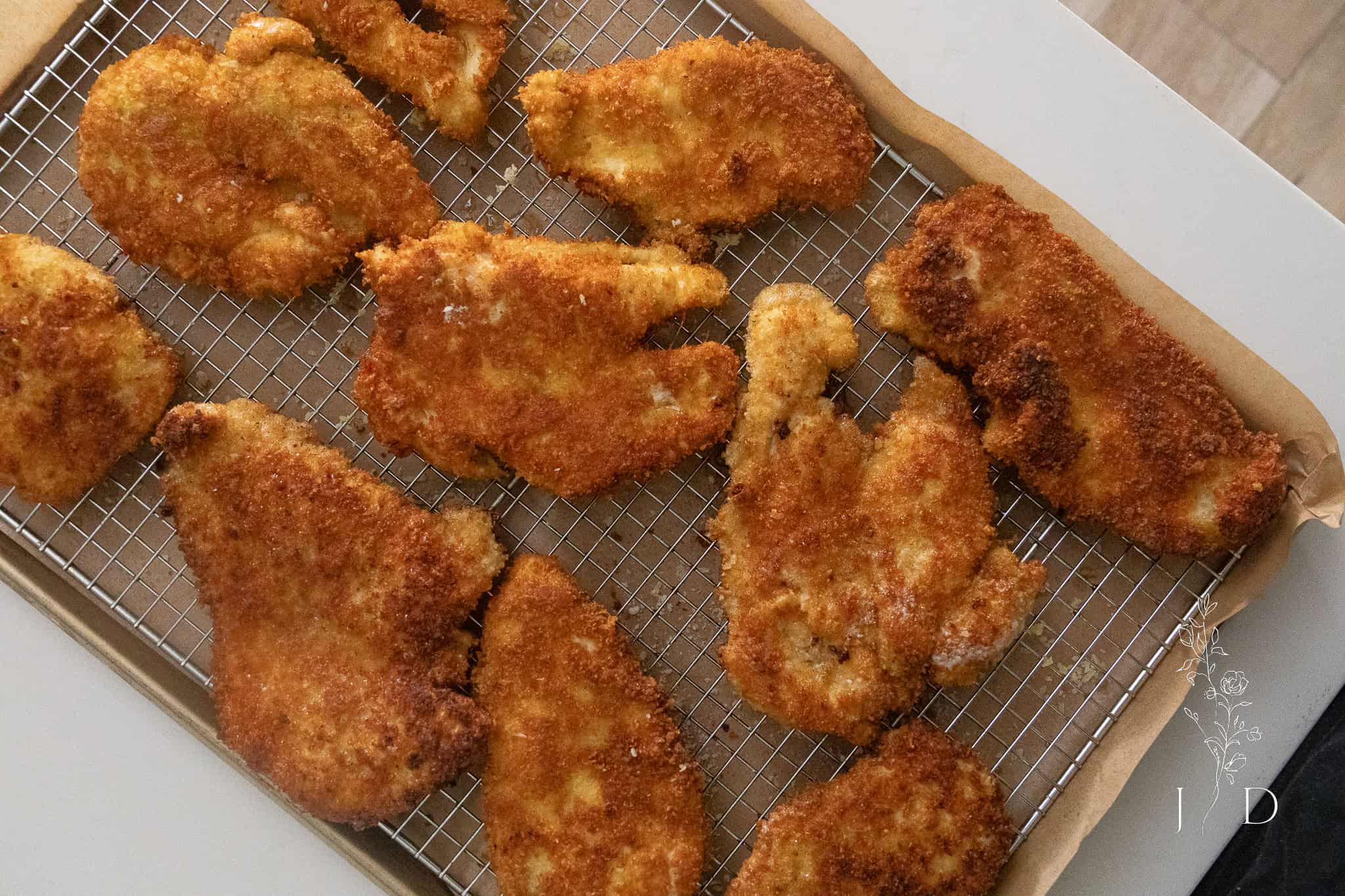 close up of chicken on a wire rack after baking 