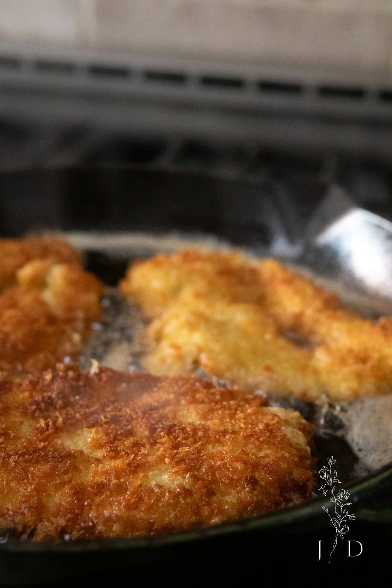 chicken frying in a pan 