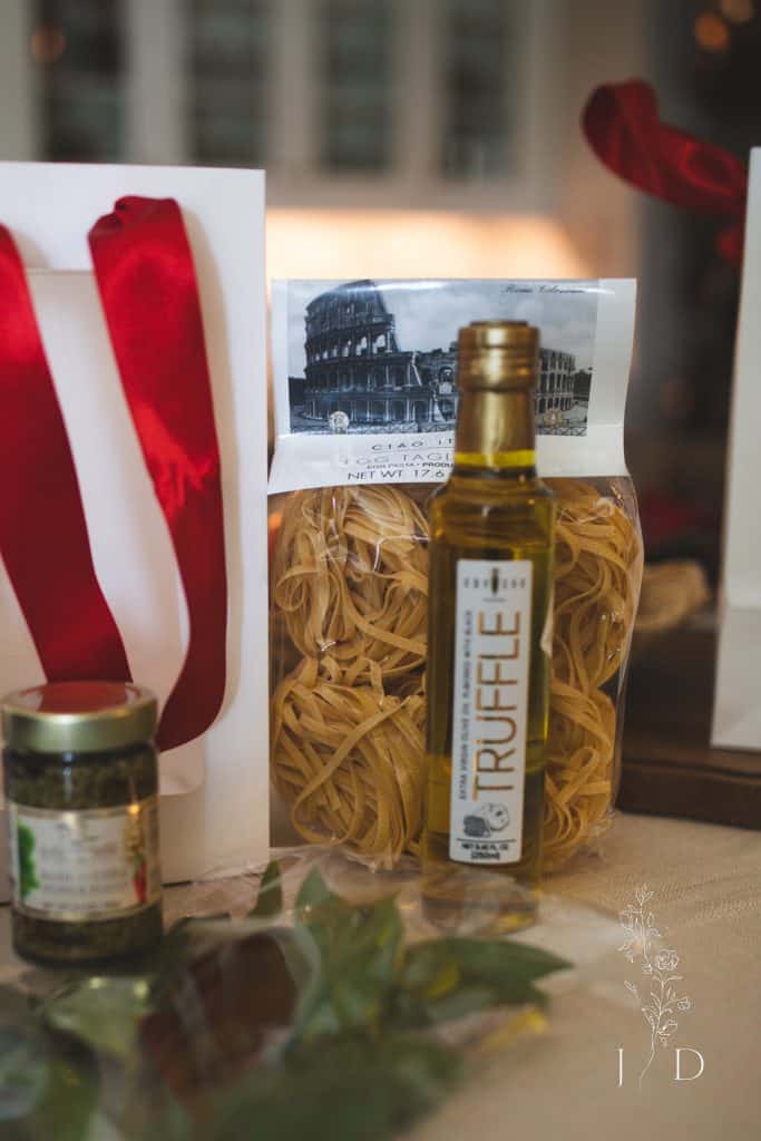 picture of a dinner party gift bag full of italian themed foods 